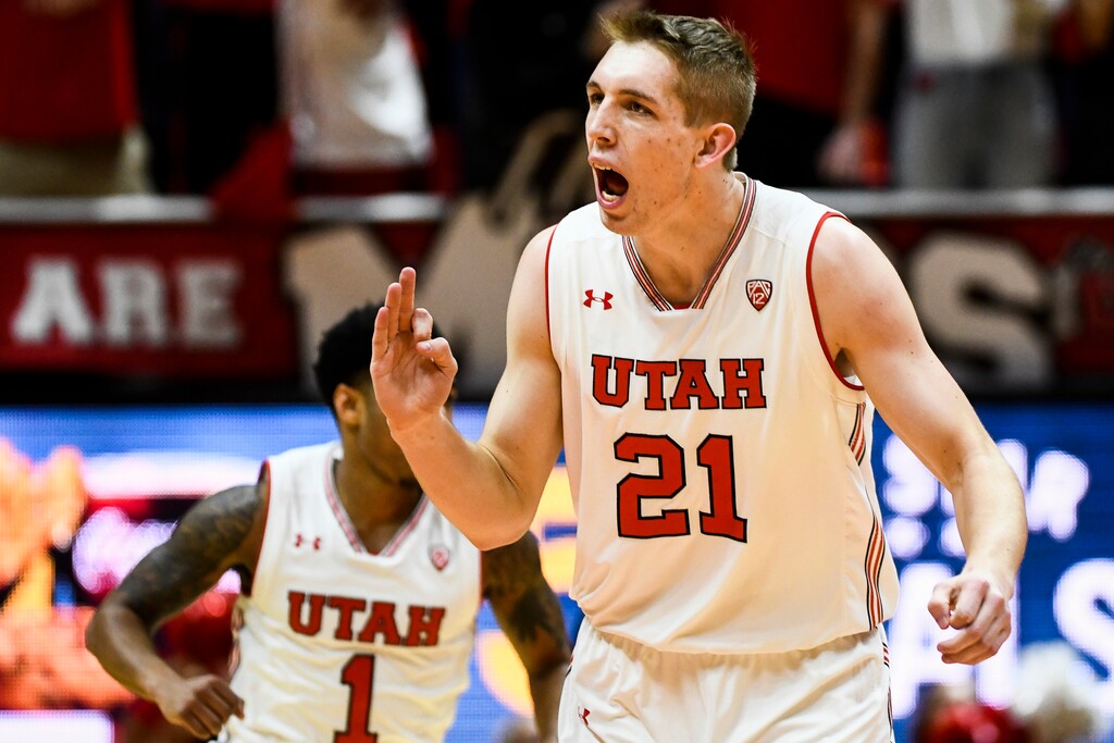 Utah forward Tyler Rawson (21) celebrates a three-point basket during the first half of an NCAA basketball game against USC on Saturday, Feb. 24, 2018, in Salt Lake City. (AP Photo/Alex Goodlett)