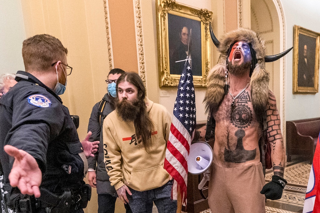 (Manuel Balce Ceneta | AP file photo)
In this Jan. 6 photo, supporters of President Donald Trump, including Jacob Chansley, right with fur hat, are confronted by U.S. Capitol Police officers outside the Senate Chamber inside the Capitol in Washington.