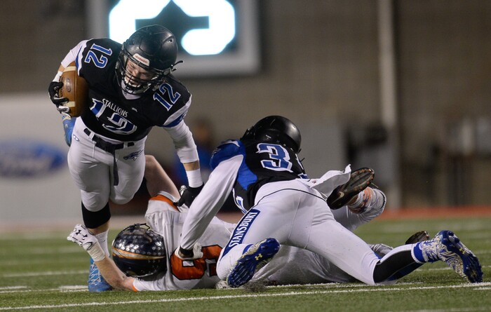 (Francisco Kjolseth  |  The Salt Lake Tribune)  Kyle McKenna of Stansbury has his legs taken out by the Mountain Crest defense in their class 4A semifinal game at Rice-Eccles Stadium, Thursday, Nov. 9, 2017.