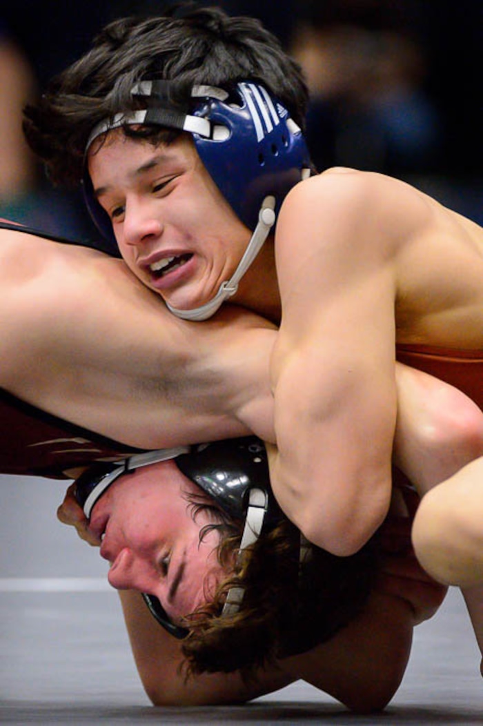 (Trent Nelson | The Salt Lake Tribune)  Brighton's Anthonee Ouk (top) and Maple Mountain's Cole Tierre Patterson, 5A State Championships, high school wrestling quarterfinals in Orem, Wednesday February 7, 2018.