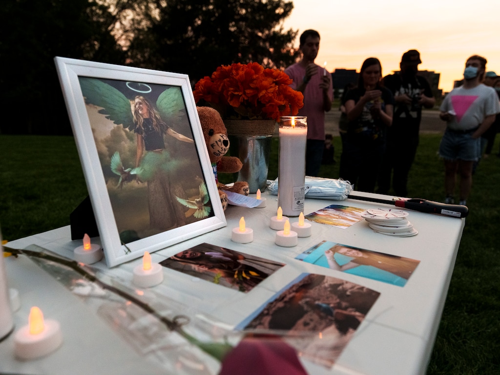 (Leah Hogsten | The Salt Lake Tribune) Pictures of Gabby Petito, candles and flowers adorn a table at a vigil at Sugar House Park, held Sept. 22, 2021, in Petito's honor. Petito traveled through Utah before she disappeared and was later found dead.