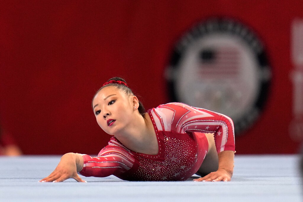 (Jeff Roberson | AP) Kara Eaker competes in the floor exercise during the women's U.S. Olympic Gymnastics Trials Friday, June 25, 2021, in St. Louis. Eaker, an alternate for the USA Gymnastics squad, tested positive for COVID-19 despite being vaccinated. She is the first American athlete to test positive in Japan.