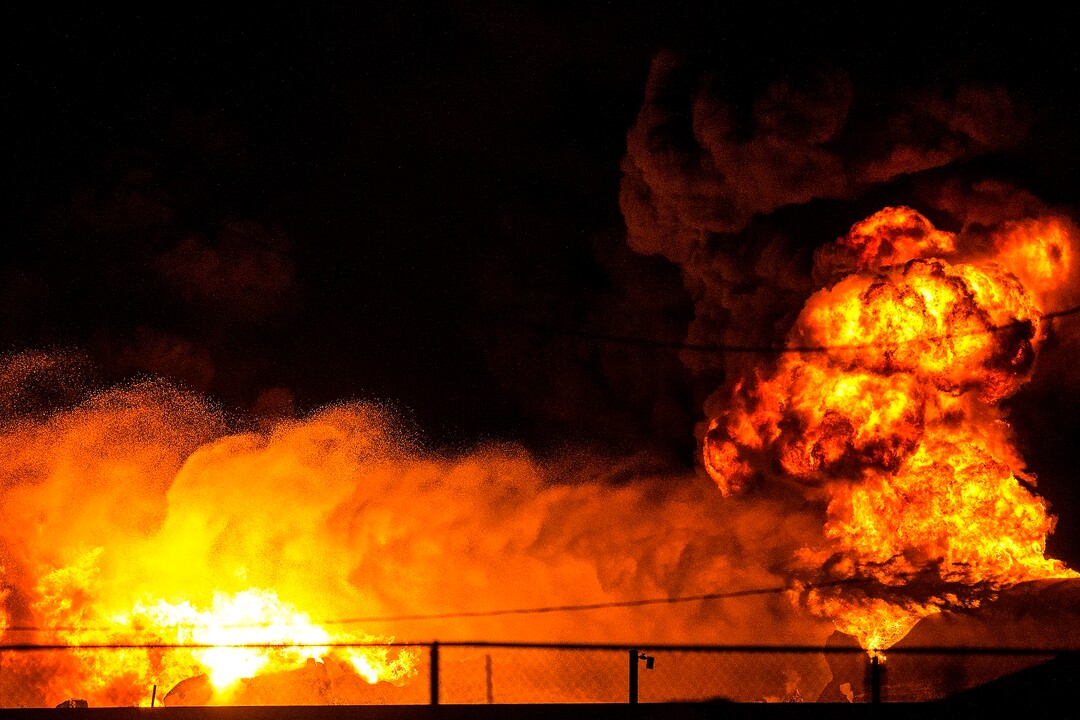 (Chris Detrick  |  The Salt Lake Tribune)  Firefighters attempt to put out a burning semitrailer that was hauling thousands of gallons of fuel on Interstate-15 in Midvale Thursday, January 18, 2018.   Lt. Todd Royce of the Utah Highway Patrol said the truck was southbound on the interstate at 7500 South at 7:20 p.m. when a tire caught fire, sending flames toward the tanks.