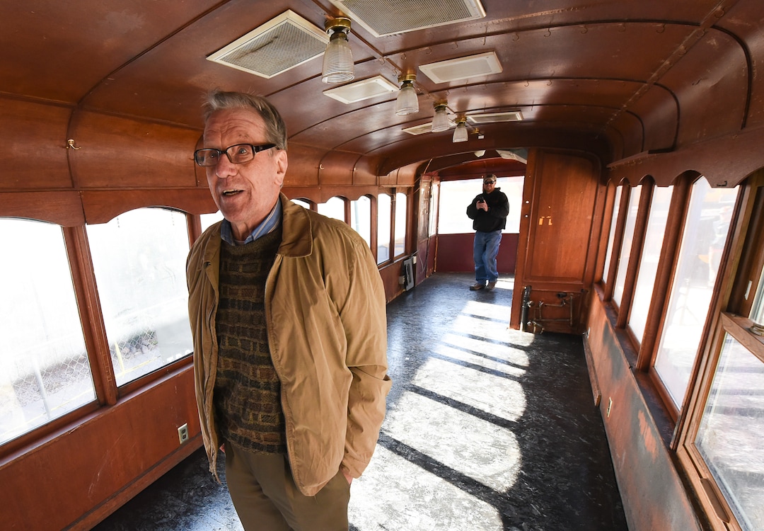 (Francisco Kjolseth  |  The Salt Lake Tribune)  Boris Walther, 78, takes a trip down memory lane as he tours the inside of the last Utah trolley car. Walther, the last living wood craftsman that worked on the trolleys back in 1972, recalls the details seen inside following a repositioning of the iconic trolley car on Monday, Oct. 15, 2018, that has been sitting in storage for several years and was placed back into view at Trolley Square.