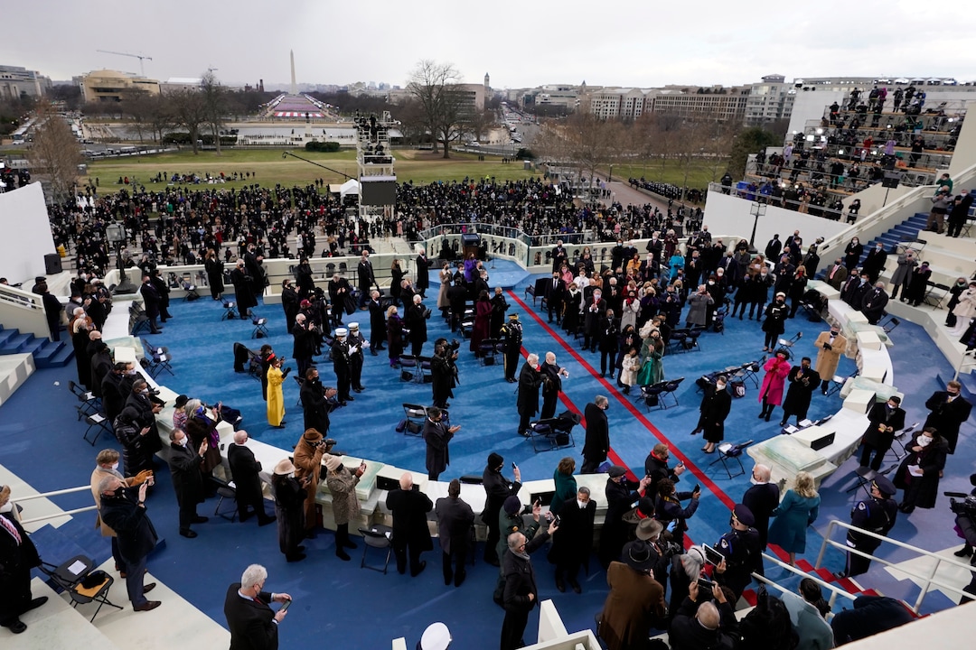 President-elect Joe Biden steps out to the portico to be sworn in as 46th president of the United States during the 59th Presidential Inauguration at the U.S. Capitol in Washington, Wednesday, Jan. 20, 2021. (AP Photo/Andrew Harnik)