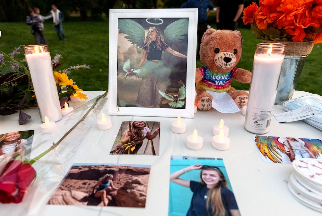(Leah Hogsten | The Salt Lake Tribune) Pictures of Gabby Petito, candles and flowers adorn a table at a vigil at Sugarhouse Park, Sept. 22, 2021 in her honor. Petito, the missing 22-year-old whose remains were found Tuesday in the area of the Spread Creek Dispersed Camping Area of Bridger-Teton National Forest on the east boundary of Grand Teton National Park.