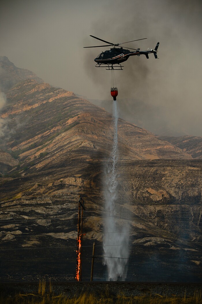 (Francisco Kjolseth  |  The Salt Lake Tribune)  Crews battle a grass fire in Tooele county being dubbed the Green Ravine fire as it burns on Tuesday, Sept. 3, 2019.