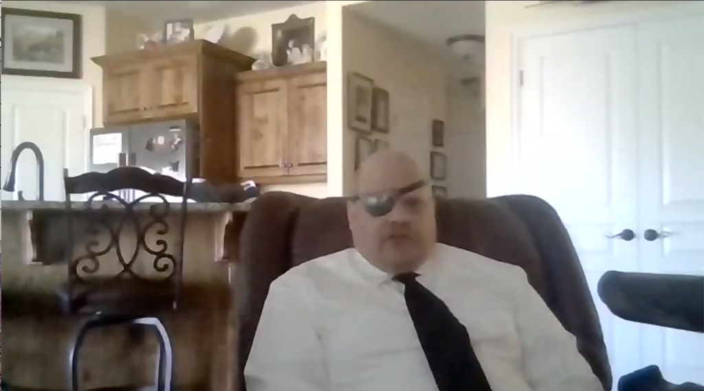 (Screenshot via Zoom) Benjamin Joseph "Joey" Herold sits during a virtual news conference Monday. Dec. 21, 2020. Herold is suing St. George and three police officers after he was pepper sprayed in the face during an arrest and lost his right eye.