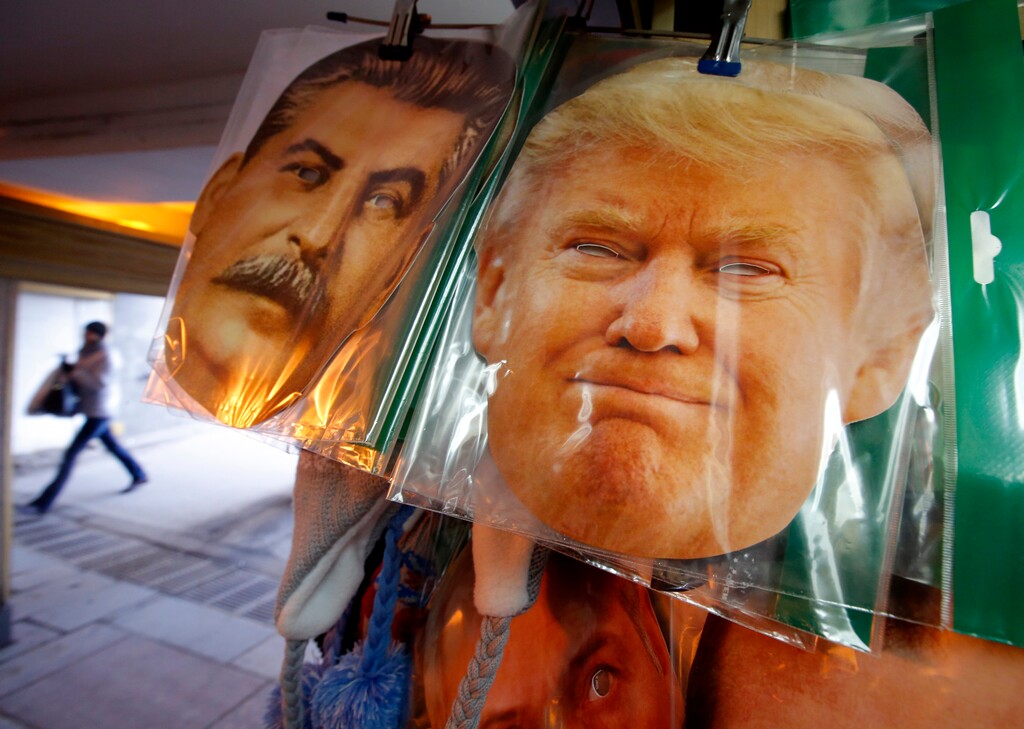 Face masks depicting former Soviet dictator Josef Stalin and Donald Trump hang on sale hours before Donald Trump is to be sworn in as president of the United States, at a souvenir street shop in St.Petersburg, Russia, Friday, Jan. 20, 2017. (AP Photo/Dmitri Lovetsky)