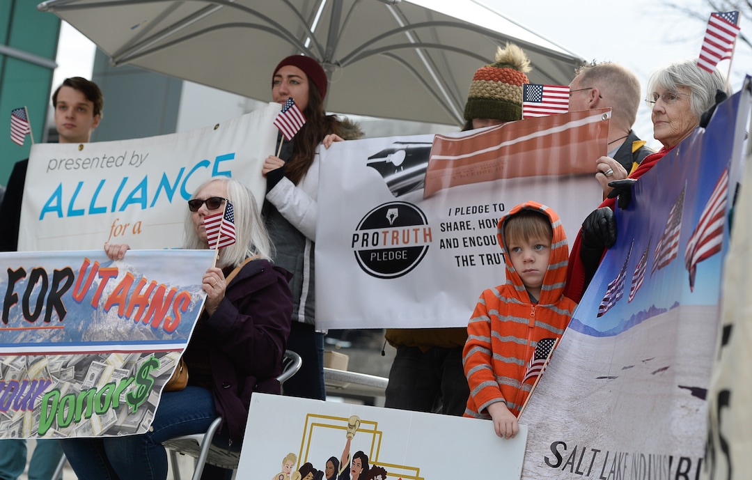 (Francisco Kjolseth  |  The Salt Lake Tribune)  A group of Utahns rally at the Wallace Bennett Federal Building in Salt Lake on Monday, Nov. 20, 2017, to tell personal stories of how they might be impacted by the tax reform plans currently on the table in Congress.