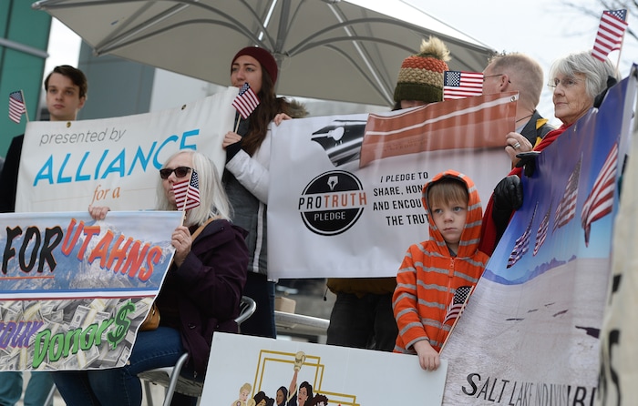 (Francisco Kjolseth  |  The Salt Lake Tribune)  A group of Utahns rally at the Wallace Bennett Federal Building in Salt Lake on Monday, Nov. 20, 2017, to tell personal stories of how they might be impacted by the tax reform plans currently on the table in Congress.