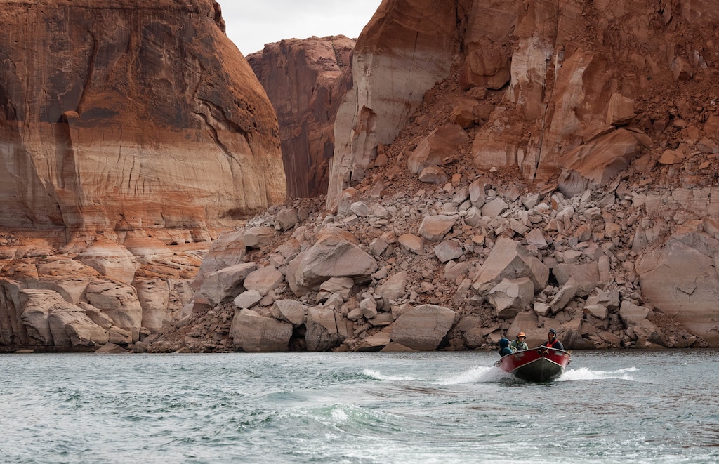 (Francisco Kjolseth | The Salt Lake Tribune) A fast-moving skiff navigates the main channel of Lake Powell on April 26, 2026. Law enforcement officials removed a body from the man-made lake last Friday.