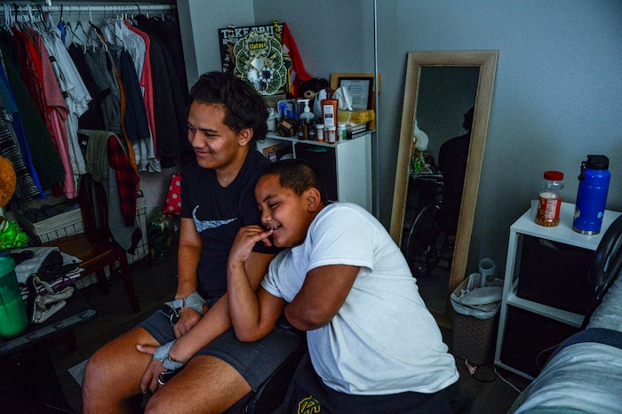 (Leah Hogsten  |  The Salt Lake Tribune) Since the accident, Stak’s youngest brother Exodus, 9, has been his constant companion and caretaker. The Audrick “Stak” Afatasi is fighting to regain movement in his lower body after being paralyzed at a trampoline park on March 15, 2019.