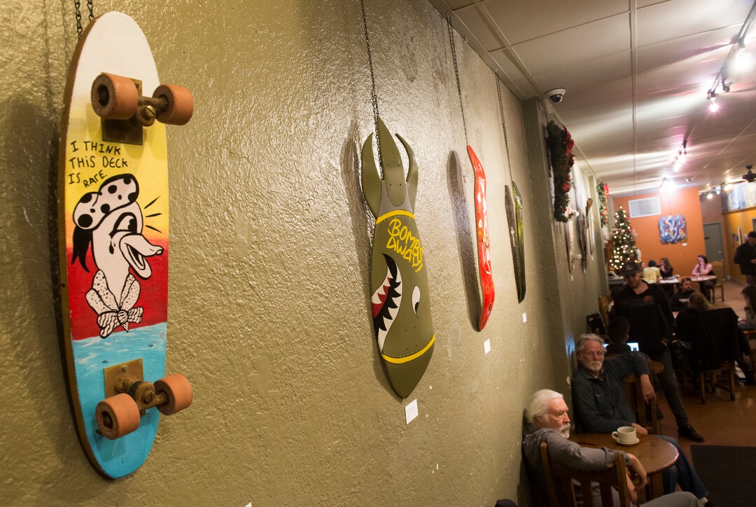 (Rick Egan  |  The Salt Lake Tribune)      A skateboard exhibit hands on the wall at Nostalgia, as live music is presented each month during the gallery stroll, Friday, Nov. 16, 2018.