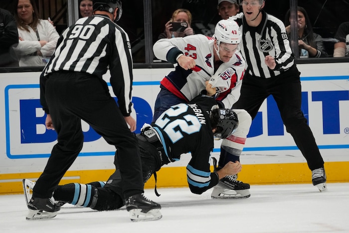 (Francisco Kjolseth | The Salt Lake Tribune) Utah Hockey Club center Jack McBain (22) fights Washington Capitals right wing Tom Wilson (43) during an NHL hockey game at the Delta Center in Salt Lake City on Monday, Nov. 18, 2024.
