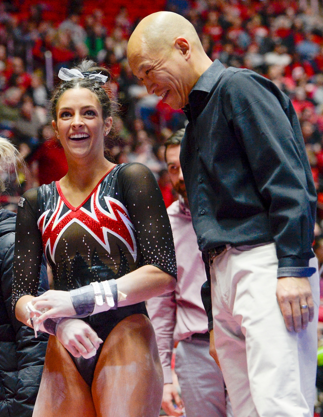 (Leah Hogsten  |  The Salt Lake Tribune) Emilie LeBlanc shares a laugh with coach Tom Farden as the University of Utah fifth-ranked gymnastics team hosts No. 12 University of Kentucky during its home opener, Jan. 3, 2020, at the Huntsman Center.