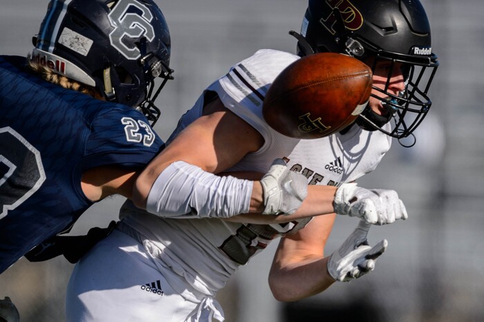 (Trent Nelson  |  The Salt Lake Tribune) Corner Canyon's Scott Iverson strips the ball from Lone Peak's Weston Covey as he nears the goal line during the 6A state football championship game at Cedar Valley High School in Eagle Mountain on Friday, Nov. 20, 2020.