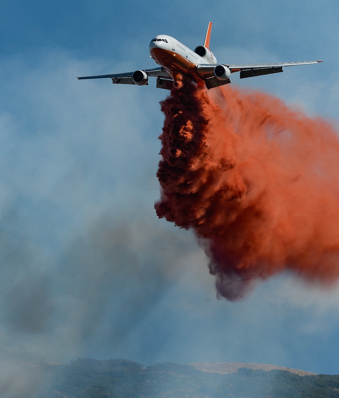 (Francisco Kjolseth  |  The Salt Lake Tribune)  Fire Crews direct a slurry bomber to unload its payload along the East Bountiful bench that grew to 150 acres early Friday morning, Aug. 30, 2019, and destroyed three homes. On Sept. 2, officials said the fire was 100% contained.
