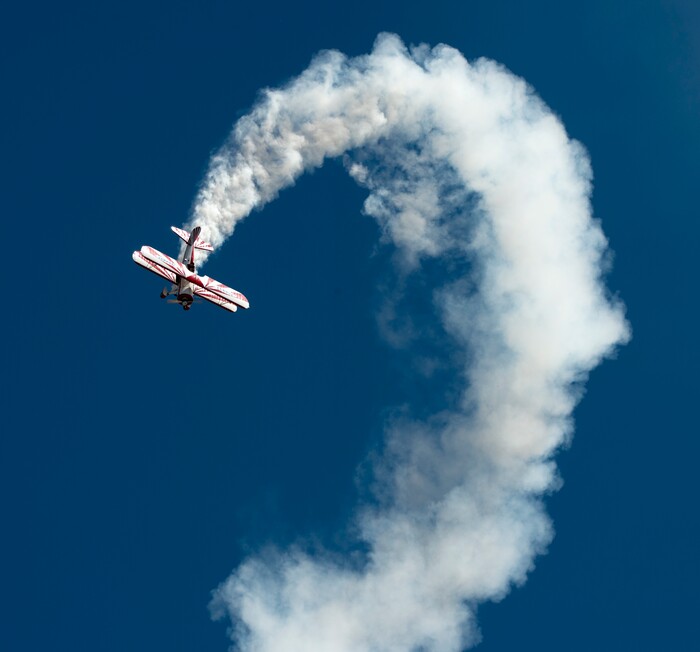 (Rick Egan  |  The Salt Lake Tribune)    Gary Rower performs in his 1941 Stearman, at the Warriors Over the Wasatch airshow at Hill Airforce Base, Sunday, June 24, 2018.