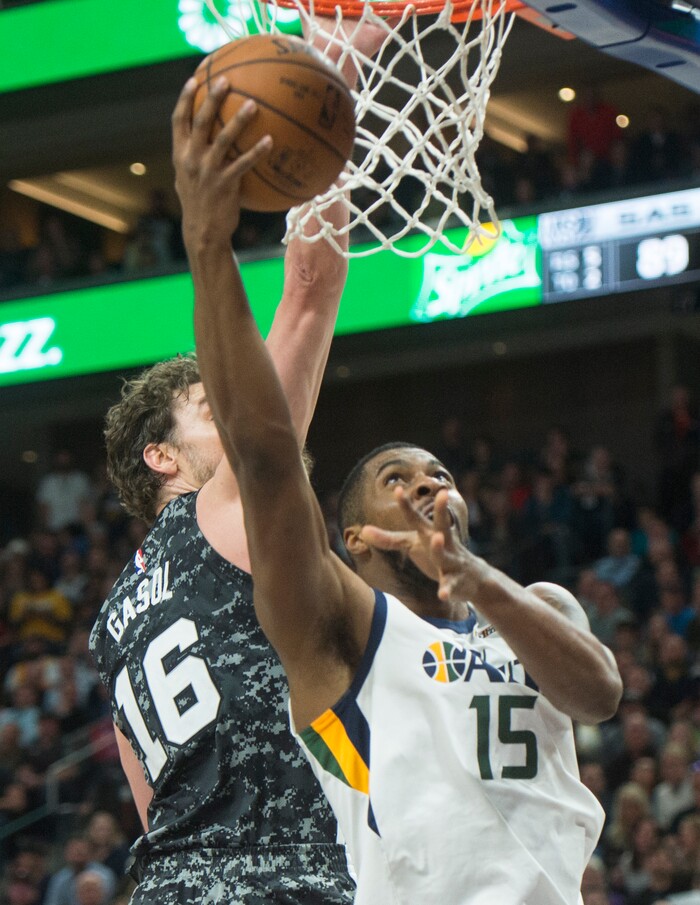 (Rick Egan  |  The Salt Lake Tribune)  Utah Jazz forward Derrick Favors (15) takes the ball to the basket, as San Antonio Spurs center Pau Gasol (16) defends,, in Salt Lake City, Monday, February 12, 2018.