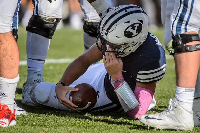 (Trent Nelson | The Salt Lake Tribune)  
Brigham Young Cougars quarterback Zach Wilson (11) is sacked as BYU hosts Northern Illinois, NCAA football in Provo, Saturday Oct. 27, 2018.