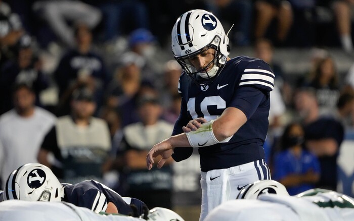 (Francisco Kjolseth | The Salt Lake Tribune) Brigham Young Cougars quarterback Baylor Romney (16) checks on his play in game action between the Brigham Young Cougars and the South Florida Bulls at LaVell Edwards Stadium in Provo, Saturday, Sept. 25, 2021.