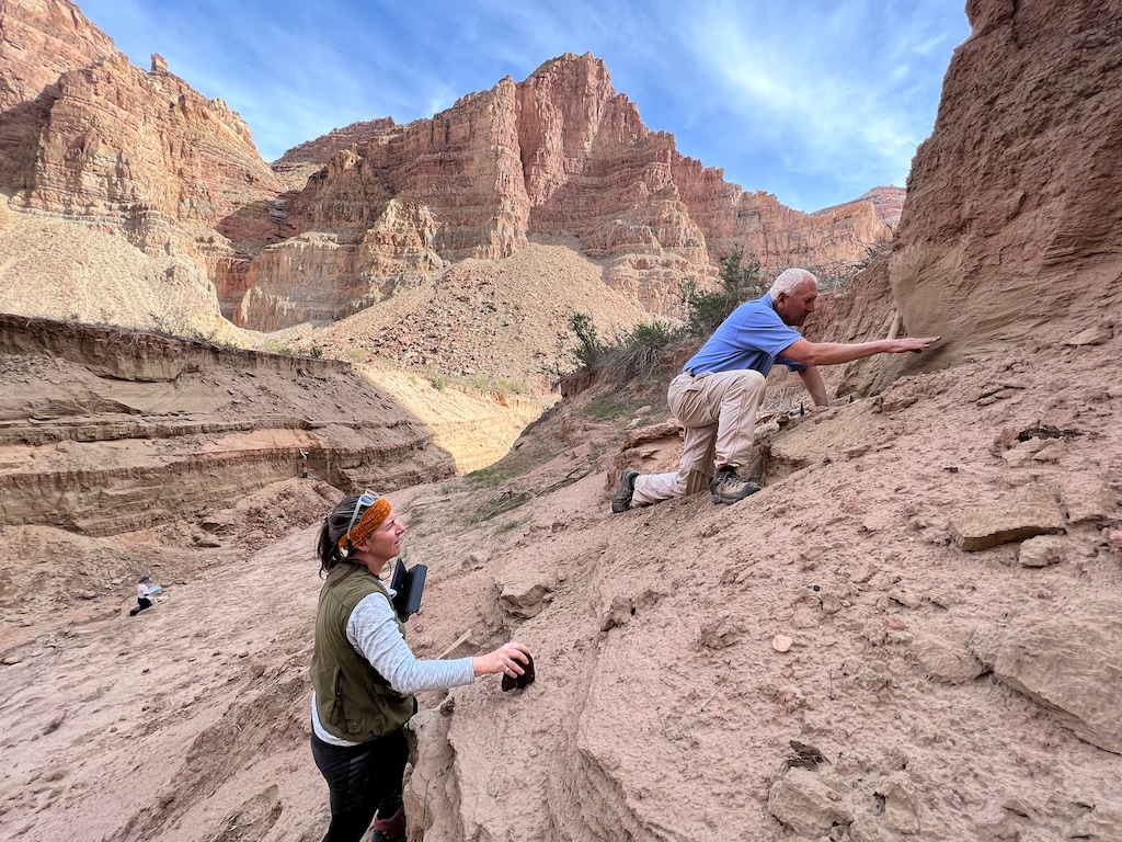 (Francisco Kjolseth | The Salt Lake Tribune) Cari Johnson, a geology professor at the University of Utah and Jack Schmidt, a professor at Utah State University’s Center for Colorado River Studies analyze the so-called Dominy Formation in Waterhole Canyon, one of the tributaries of the Colorado River in Cataract Canyon. The mountains of sediment illustrate the high water mark once reached by Lake Powell before its retreat as flooding events slowly carve away at the sediment. 