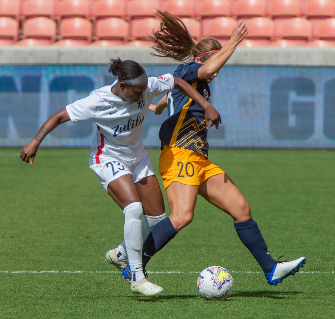 (Rick Egan  |  The Salt Lake Tribune)   OL Reign FC defender Taylor Smith (23) goes for the ball along with Utah Royals FC forward Mallory Weber (20) in soccer action between Utah Royals FC and Ol Reign FC at Rio Tinto Stadium in Sandy, Saturday, Sept. 26, 2020.