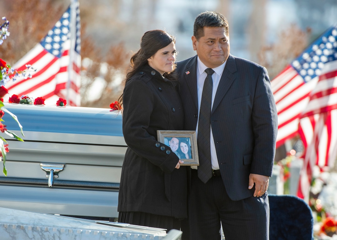 (Rick Egan  |  The Salt Lake Tribune)   McKenzie Fuchigami, stands by the casket with  Kirk T. Fuchigami Sr, after the funeral for her husband Kirk T. Fuchigami Jr. who was killed last month in Afghanistan, Monday, Dec. 9, 2019.