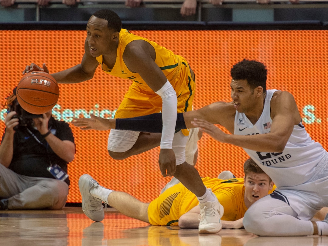 (Rick Egan  |  The Salt Lake Tribune)  Brigham Young Cougars forward Yoeli Childs (23) goes for a loose ball along with San Francisco Dons guard Jamaree Bouyea (1), in WCC basketball action at the Marriott Center, Thursday, February 21, 2018.