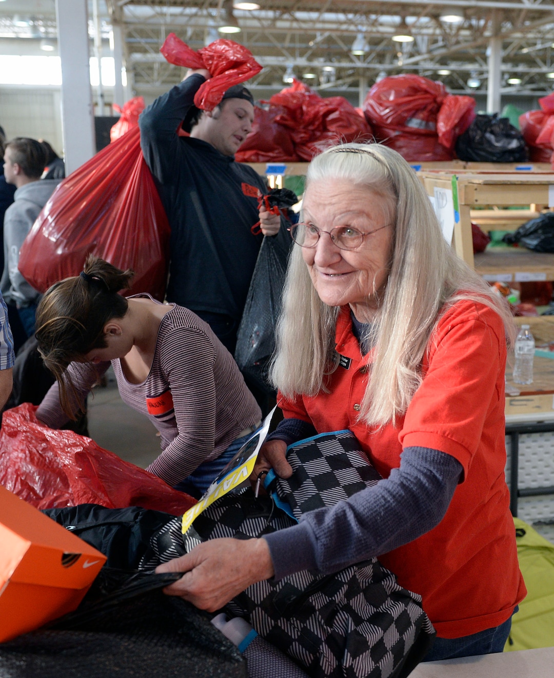 (Al Hartmann  |  The Salt Lake Tribune) 	Salt Lake City Corps vounteer Ruth Ann Majnik fills a Christmas present order for a family in need at the Salvation Army's Angel Tree distribution warehouse at the Utah State Fairgrounds.   Needy families living in the Salt Lake School District picked up their bags of presents Friday Dec. 22, just in time for Christmas. 