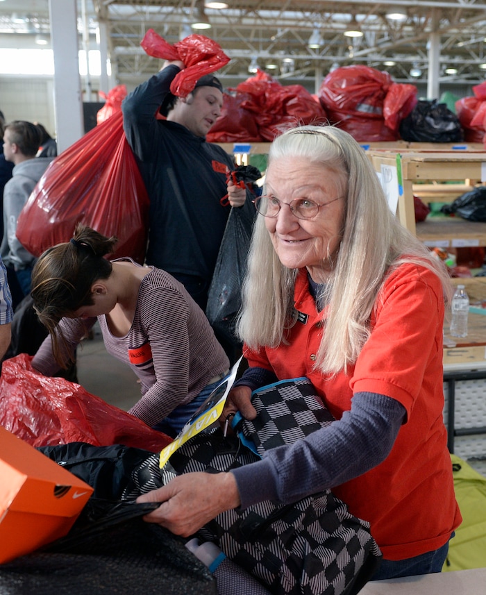 (Al Hartmann  |  The Salt Lake Tribune) 	Salt Lake City Corps vounteer Ruth Ann Majnik fills a Christmas present order for a family in need at the Salvation Army's Angel Tree distribution warehouse at the Utah State Fairgrounds.   Needy families living in the Salt Lake School District picked up their bags of presents Friday Dec. 22, just in time for Christmas. 