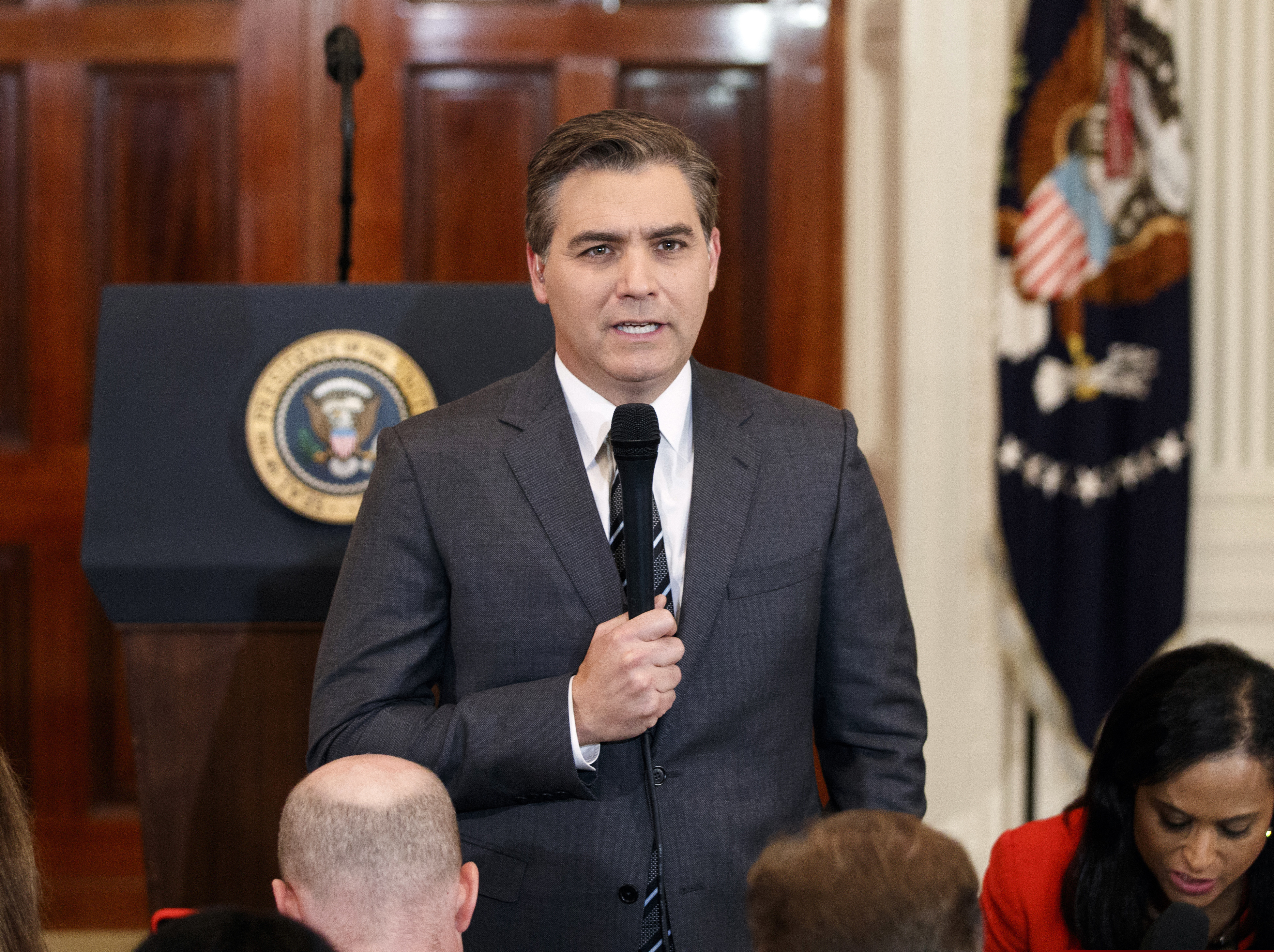 (Evan Vucci | The Associated Press) In this Nov. 7, 2018, file photo, CNN journalist Jim Acosta does a standup before a new conference with President Donald Trump in the East Room of the White House in Washington. CNN sued the Trump administration Tuesday, demanding that correspondent Jim Acosta’s credentials to cover the White House be returned because it violates the constitutional right of freedom of the press.