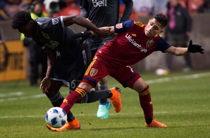 (Rick Egan  |  The Salt Lake Tribune)      Real Salt Lake forward Jefferson Savarino (7) goes for the ball along with Vancouver Whitecaps forward Alphonso Davies (67), in MLS action between Real Salt Lake and Vancouver Whitecaps, at Rio Tinto Stadium beSaturday, April 7, 2018.


