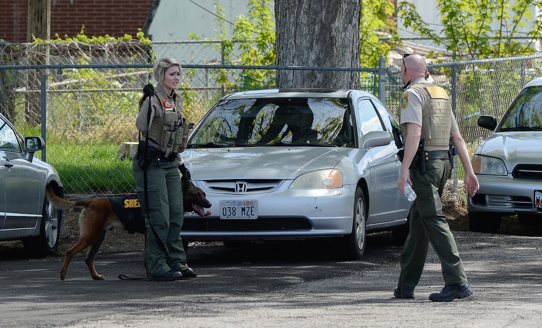 (Francisco Kjolseth  |  The Salt Lake Tribune)  Police work near the scene of a shooting at Pawn and Sales, 135 S. and 500 West, in Bountiful on Friday, May 4, 2018, where two men attempted to rob the store. One suspect was killed in a "scuffle" with a staff member while the other one fled the scene.