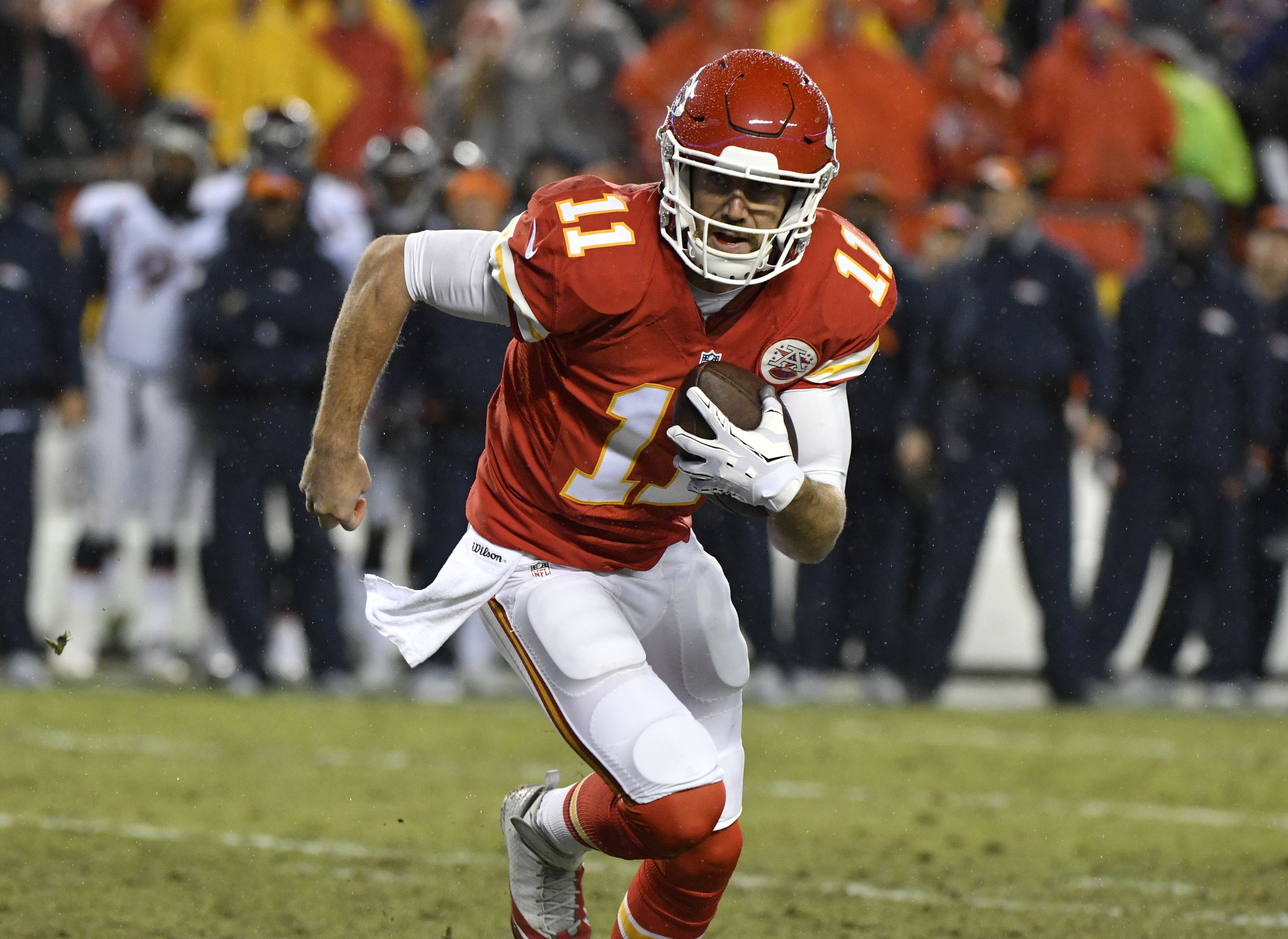 Kansas City Chiefs quarterback Alex Smith (11) runs for a touchdown during the first half of an NFL football game against the Denver Broncos in Kansas City, Mo., Sunday, Dec. 25, 2016. (AP Photo/Ed Zurga)