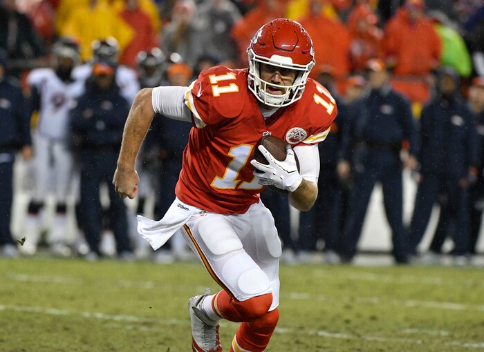 Kansas City Chiefs quarterback Alex Smith (11) runs for a touchdown during the first half of an NFL football game against the Denver Broncos in Kansas City, Mo., Sunday, Dec. 25, 2016. (AP Photo/Ed Zurga)