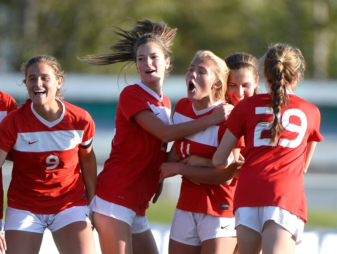 (Scott Sommerdorf   |  The Salt Lake Tribune)   East's Sami Black, #11, celebrates her second half free kick goal with team mates as East beat Corner Canyon 4-1 in a Class 5A girls' soccer state quarterfinal, Thursday, October 12, 2017. 