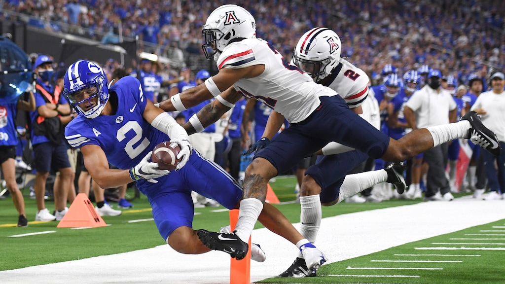 BYU wide receiver Neil Pau'u (2) scores a touchdown against Arizona during the second half of an NCAA college football game Saturday, Sept. 4, 2021, in Las Vegas. (AP Photo/David Becker)