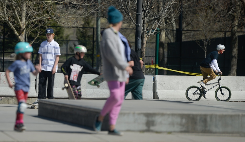 (Francisco Kjolseth  |  The Salt Lake Tribune) A "skate park closed" sign is ignored and set aside as people continue to use skateboards, dirt jumpers, BMX bikes and pro scooters at Fairmont Skatepark in Salt Lake City on Friday, April 3, 2020, during the coronavirus pandemic.  