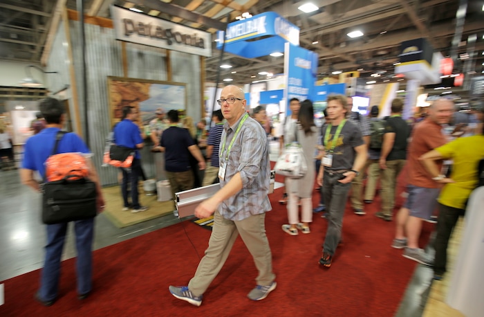 People attend the Outdoor Retailer show Friday, Aug. 5, 2016, in Salt Lake City. Thousands of people are expected in Salt Lake City this week to take part in the world's largest outdoor retail show that comes twice a year to Utah. The Outdoor Retailer show allows store owners to meet with manufacturers and suppliers to preview new products. (AP Photo/Rick Bowmer)