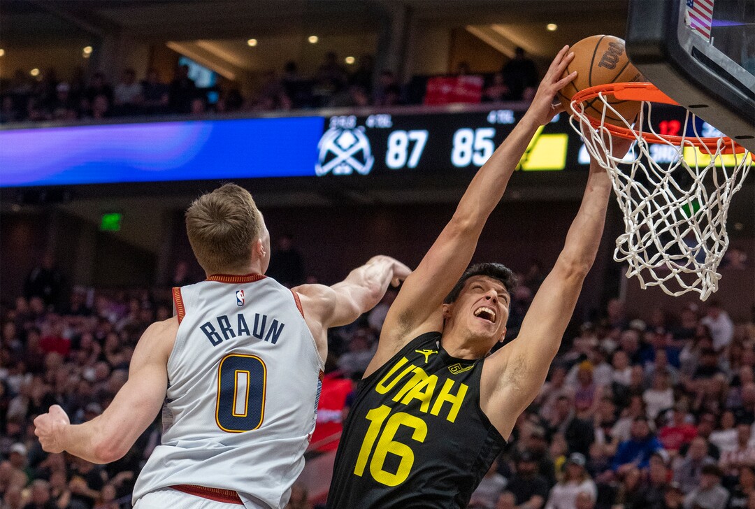 (Rick Egan | The Salt Lake Tribune) in Utah Jazz forward Simone Fontecchio (16) dunks the ball as Denver Nuggets guard Christian Braun (0) defends, in NBA action between the Utah Jazz and the Denver Nuggets at Vivint Arena,  Saturday, April 8, 2023.