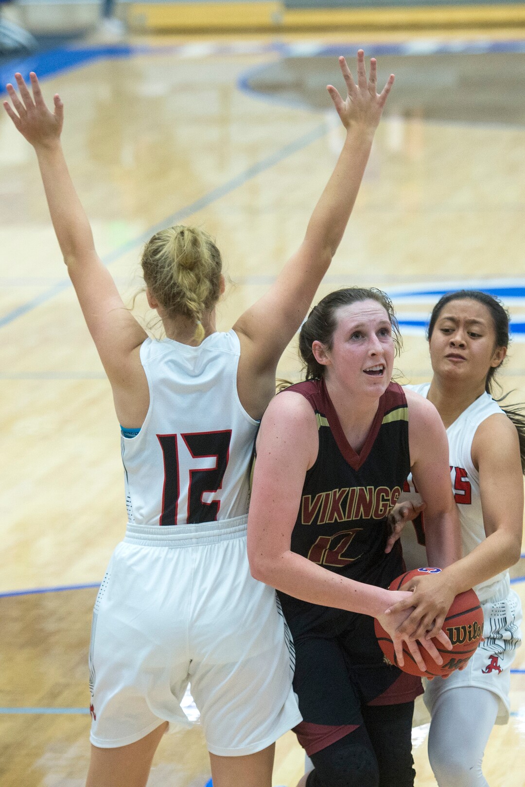 (Chris Detrick  |  The Salt Lake Tribune)  Viewmont's Mercedes Staples (12) runs through Alta's Ally Braithwaite (12) and Alta's Kamry Pan (4) during the game at Pleasant Grove High School Thursday, November 30, 2017.  Viewmont defeated Alta 65-44.