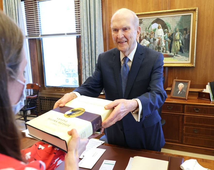(The Church of Jesus Christ of Latter-day Saints)
President Russell M. Nelson receives a copy of “The Joseph Smith Papers: Revelations and Translations, Volume 5: Original Manuscript of the Book of Mormon." Nelson has written that God's love is conditional, an assertion that remains hotly debated to this day.