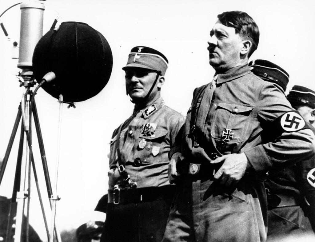(AP file photo) In this May 7, 1933, photo,  German chancellor Adolf Hitler speaks to 30,000 uniformed Nazi storm troopers at Kiel, Germany. In March 1933, six years before the war began, Adolf Hitler’s storm troopers violently shut down a small German newspaper, the Munich Post, that had devoted close to a decade warning about Hitler’s dangers to a free society. A recent biography published by The Associated Press called, “Enemy of the People: The Munich Post and the Journalists Who Opposed Hitler” by Terrence Petty, captures the early era of Nazi Germany.