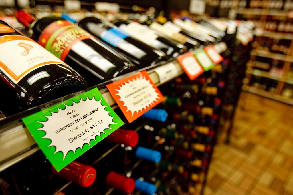 (Tribune file photo) Signs in a state-run liquor store advertise discount prices.