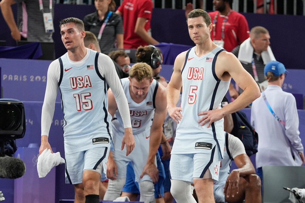 (Frank Franklin II | AP) Dylan Travis (15), of the United States, Jimmer Fredette (5) and Canyon Barry (6) react after a men's 3x3 basketball pool round match against Latvia during the 2024 Summer Olympics, Friday, Aug. 2, 2024, in Paris. Serbia won 19-16. Latvia won 21-19.
