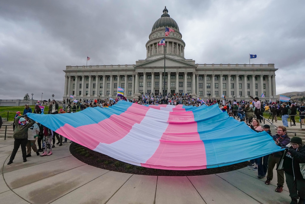 (Francisco Kjolseth  | The Salt Lake Tribune) A large transgender flag is carried by participants at a rally at the Utah State Capitol on March 29, 2025.