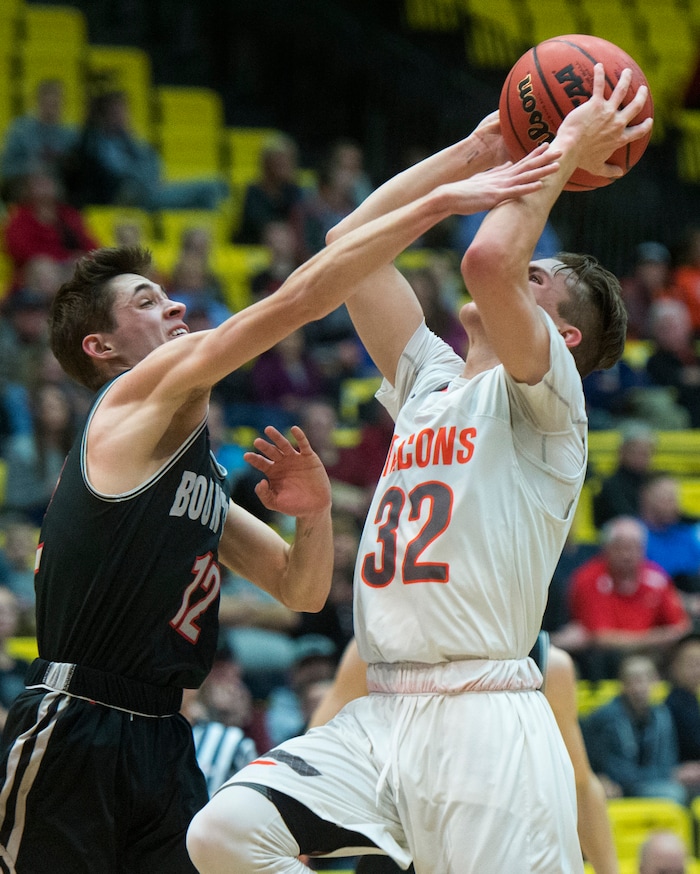 (Rick Egan  |  The Salt Lake Tribune)   Bountiful Braves Jadon Chism (12) keeps Skyridge Falcons Joe White (32) from scoring, in 5A basketball playoff action between the Bountiful Braves and Skyridge Falcons, at the UCCU Center in Orem, Monday, Feb. 26, 2018.