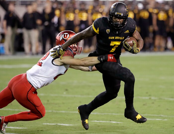 Arizona State running back Kalen Ballage (7) sheds Utah defensive back Chase Hansen (22) during the first half of an NCAA college football game, Thursday, Nov. 10, 2016, in Tempe, Ariz. (AP Photo/Matt York)